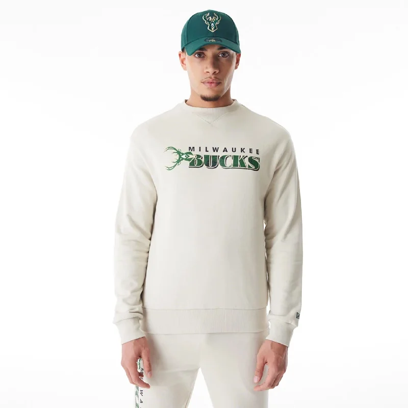Upgrade your wardrobe with stylish clothing at discounted prices. Milwaukee Bucks NBA Graphic Cream Crew Neck Sweater Upgrade your wardrobe with stylish clothing at discounted prices. Milwaukee Bucks NBA Graphic Cream Crew Neck Sweater